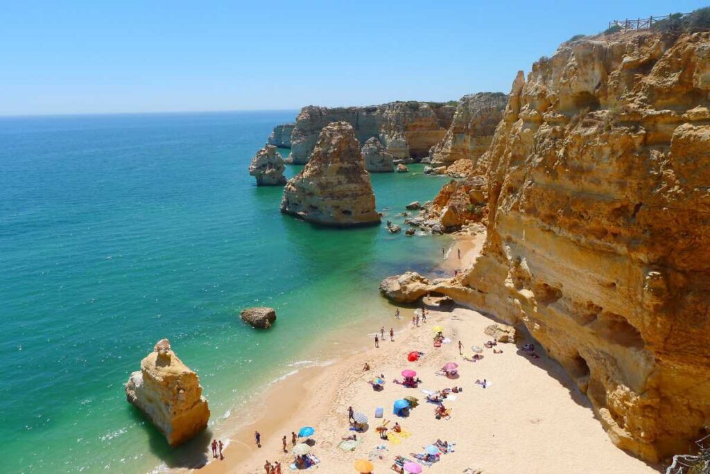 Aerial view of a senior friendly beach in Algarve Portugal with turquoise water