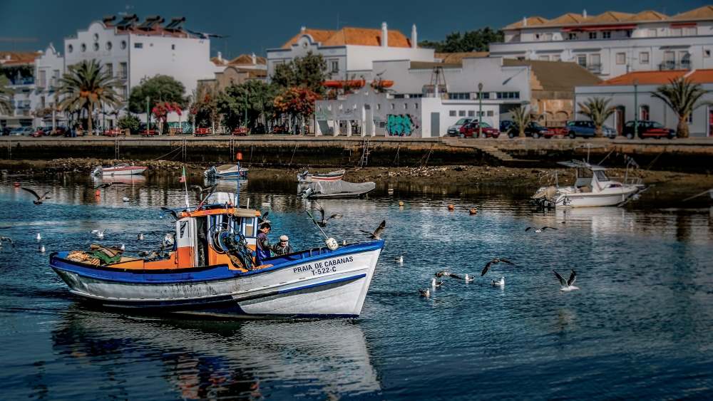 Traditional fishing boats in Tavira Algarve Portugal for senior travelers