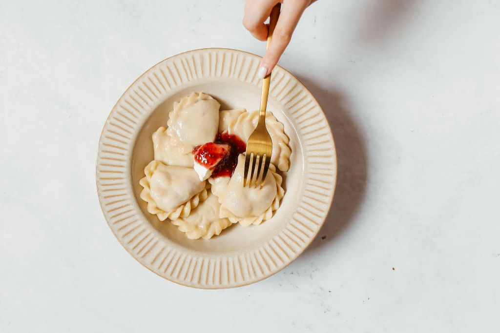 Traditional Polish pierogi dish for senior travelers in Krakow